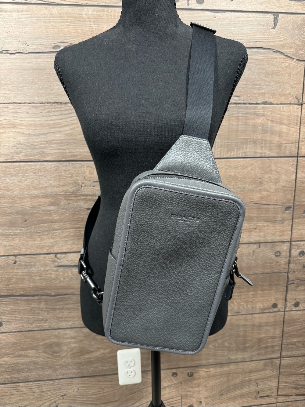 Coach Sullivan Pack in a gray or graphite pebble leather finish.